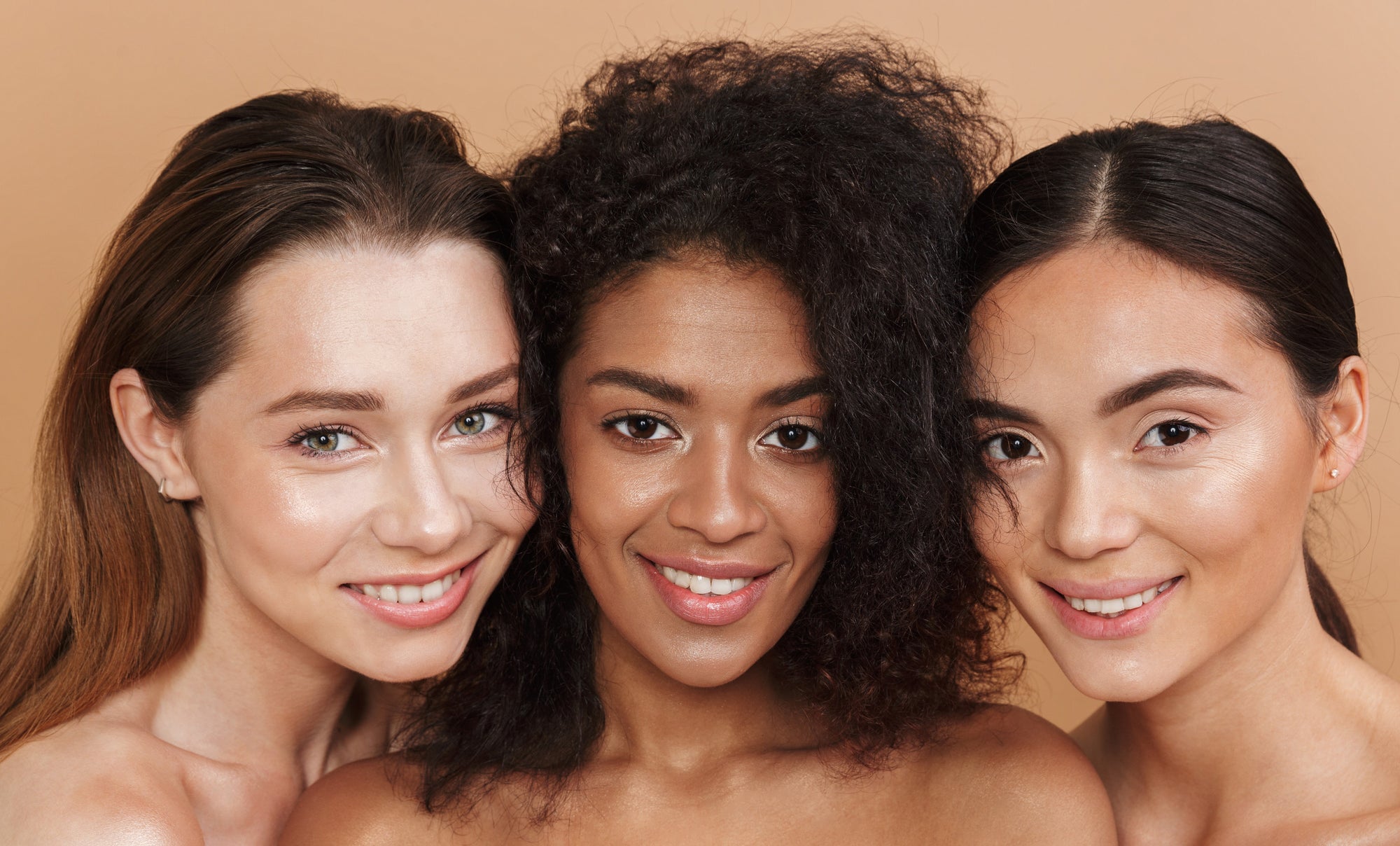 image of a Caucasian, African-American, and Asian women with clear and glowing skin.-American, and , 